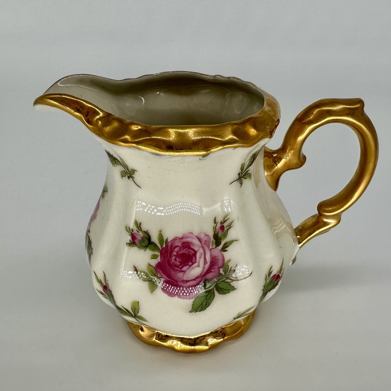 Creamer with decal with drawing. Porcelain ivory series