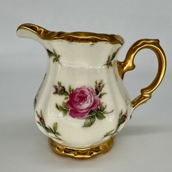 Creamer with decal with drawing. Porcelain ivory series