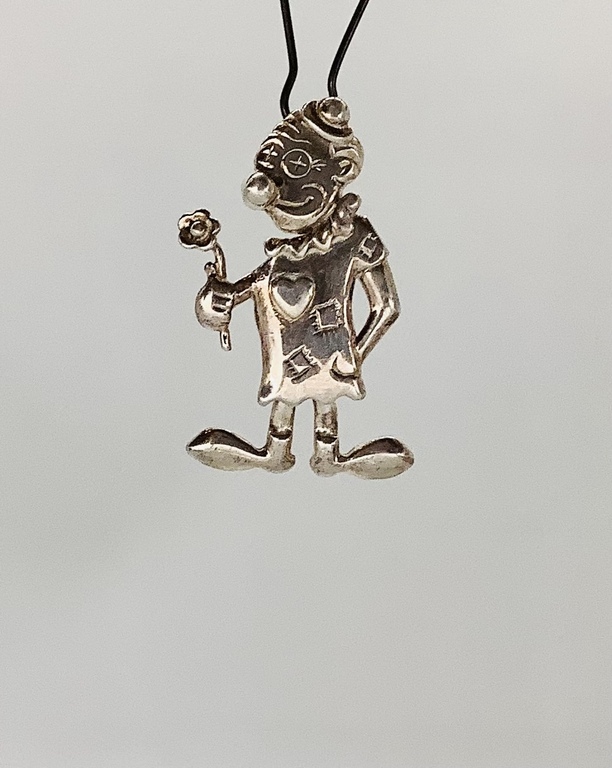 Pendant, Silver. Clown in love. All parts of the body, movable. Last century. France.