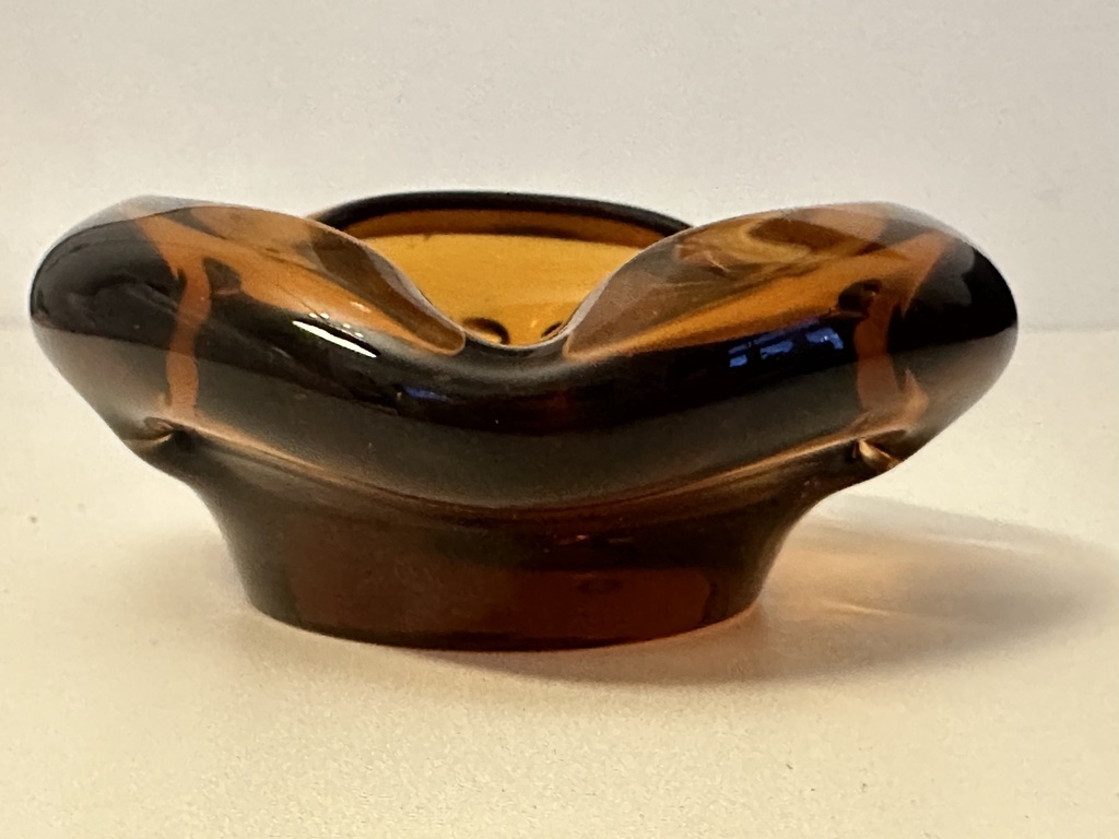 Honey colored glass ashtray