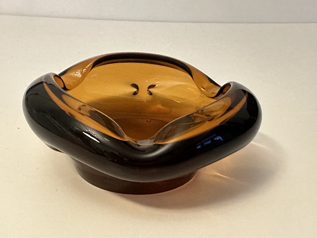 Honey colored glass ashtray