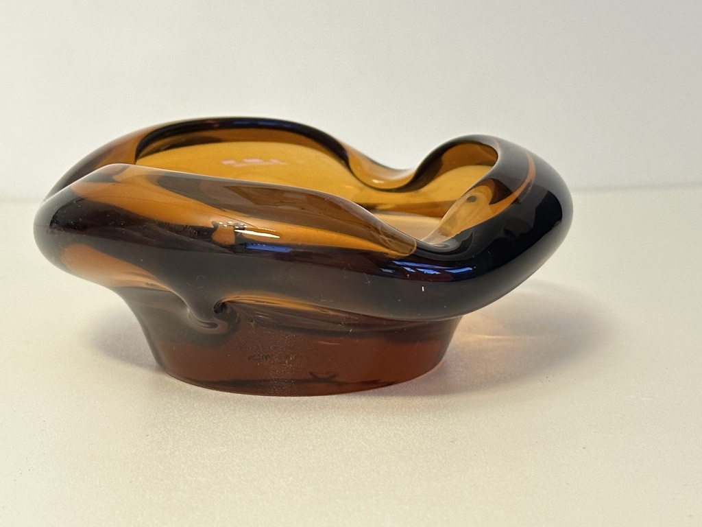 Honey colored glass ashtray