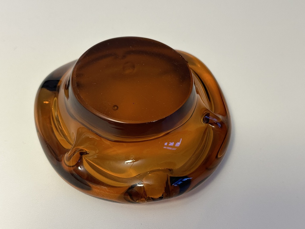 Honey colored glass ashtray