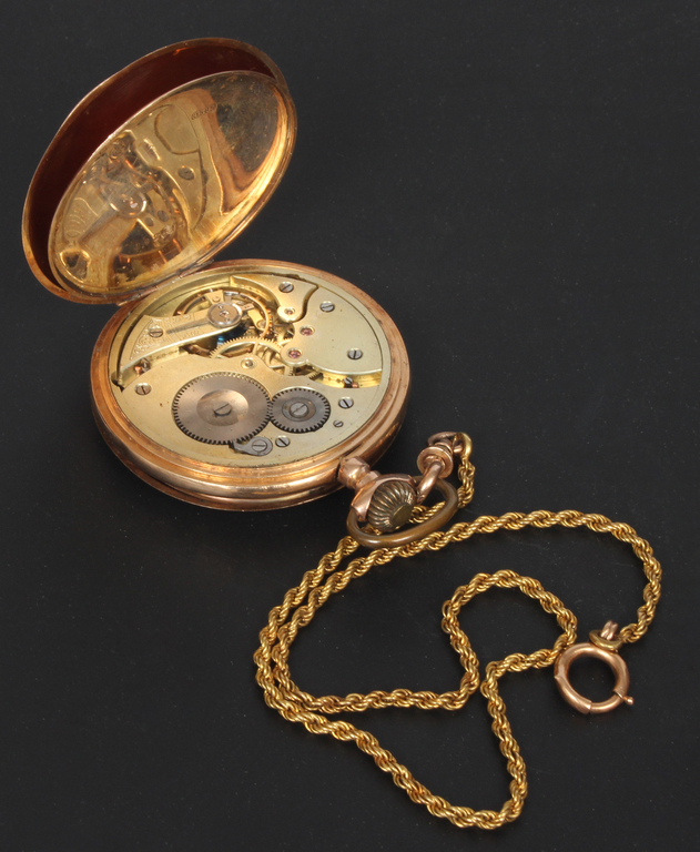 Gold pocket watch with gold chain
