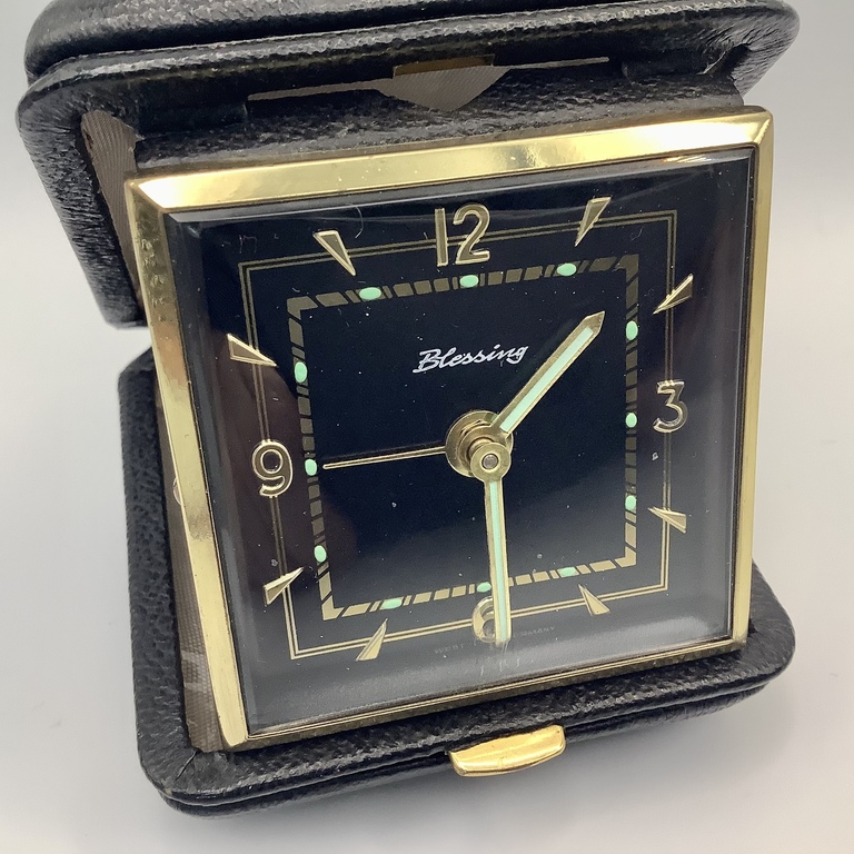 Travel watch in a leather case. Excellent condition. Alarm clock.
