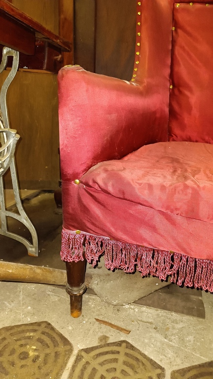 Sofa upholstered with red fabric