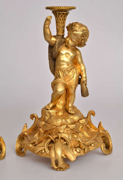 A pair of gilt bronze candlesticks