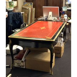 Ebony table with leather surface and gilded bronze finishing details