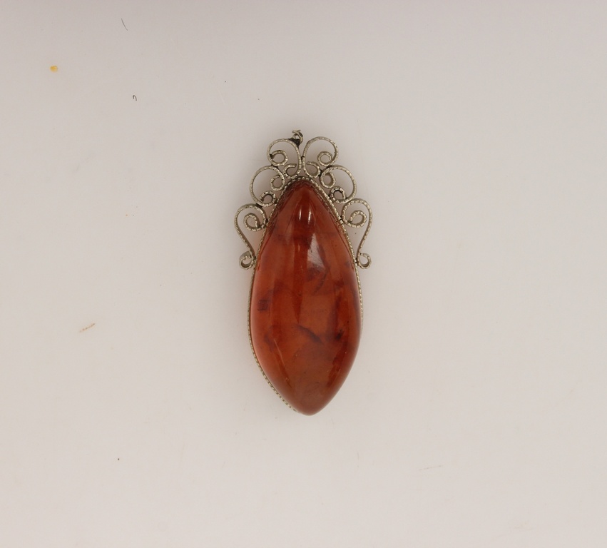 Amber pendant with metal finish