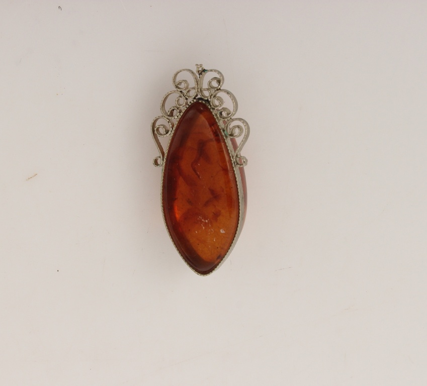 Amber pendant with metal finish