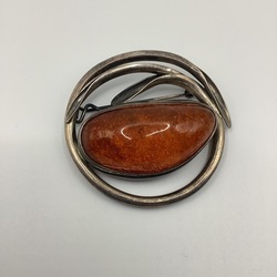 Large brooch made of natural Baltic amber. Silver. The work of an old Latvian jeweler.