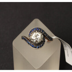 Gold and silver alloy ring with one natural diamond and 30 natural sapphires