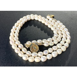 Double row freshwater pearl necklace. Oval shaped pearls. 