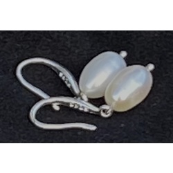 Silver earrings with white freshwater pearls, oval-shaped pearls. 