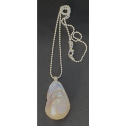 Oversized Baroque pearl pendant on a silver chain. 