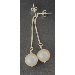 Silver earrings with white Akoya pearls.