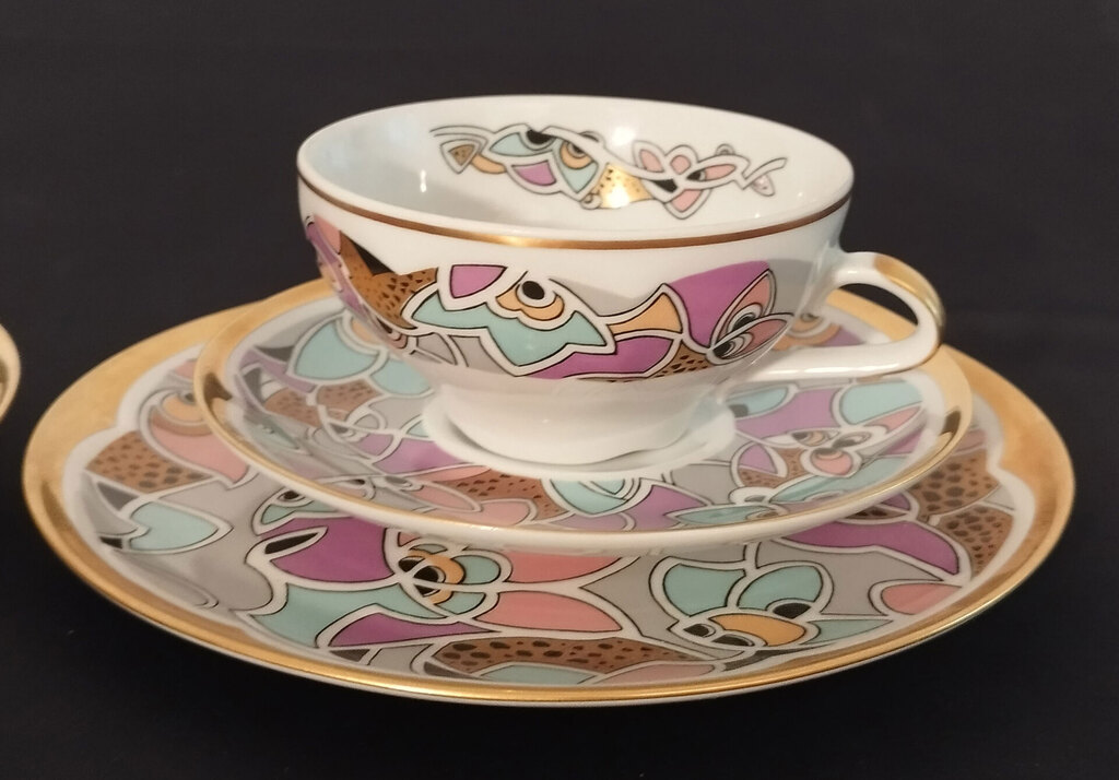 Two porcelain cups with saucers and a plate