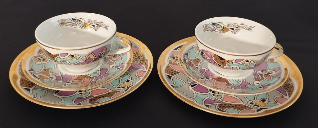 Two porcelain cups with saucers and a plate