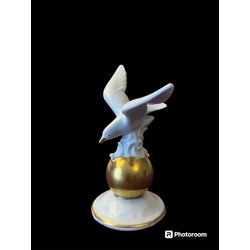 statuette of a seagull on a golden ball, 