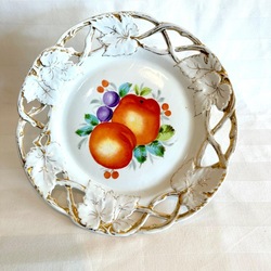 Antique plate made of slotted porcelain with fruit potives. Russia. Kuznetsov in Dulevo. 24 cm