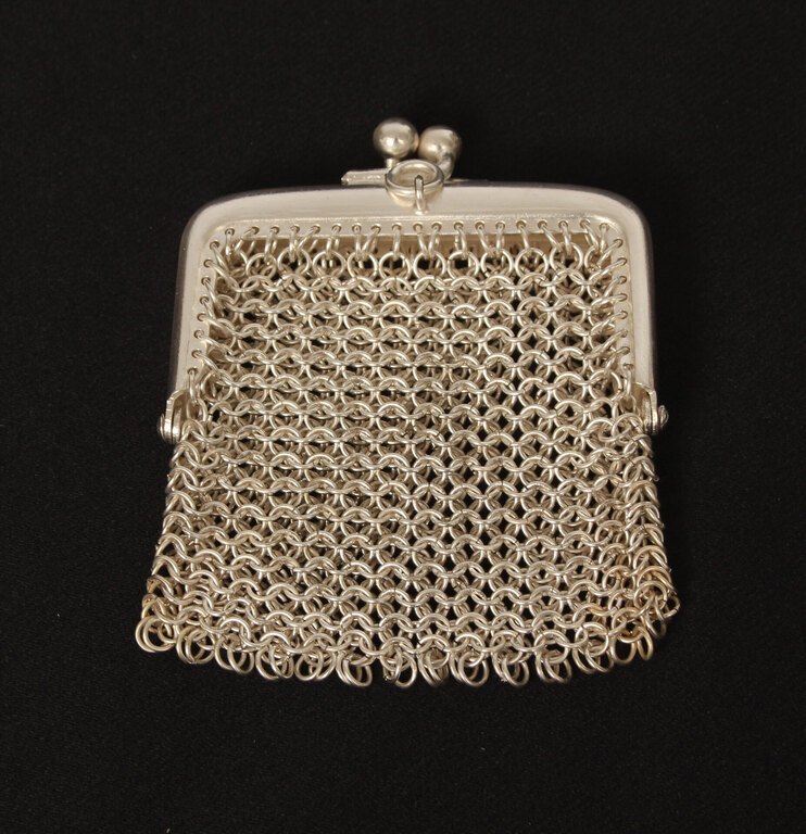 A small silver-plated metal purse