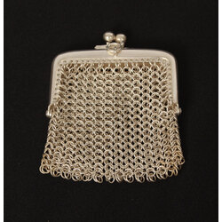 A small silver-plated metal purse