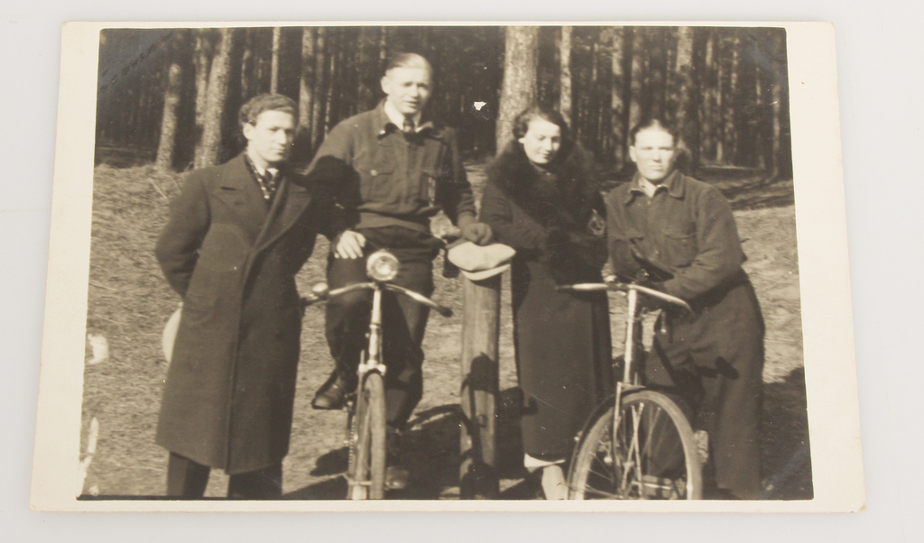 Photograph 2 men with women and bicycles