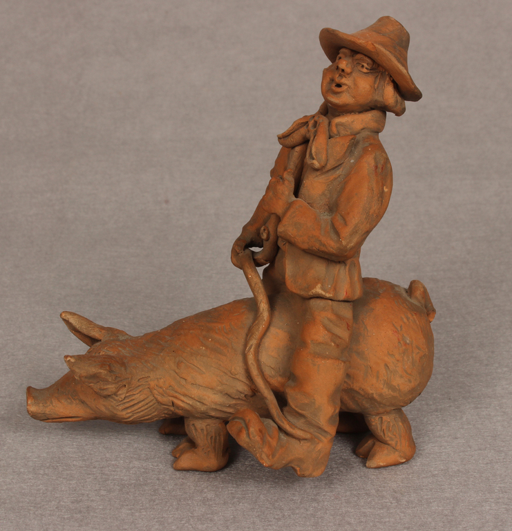 Ceramic figurine Man on a pig