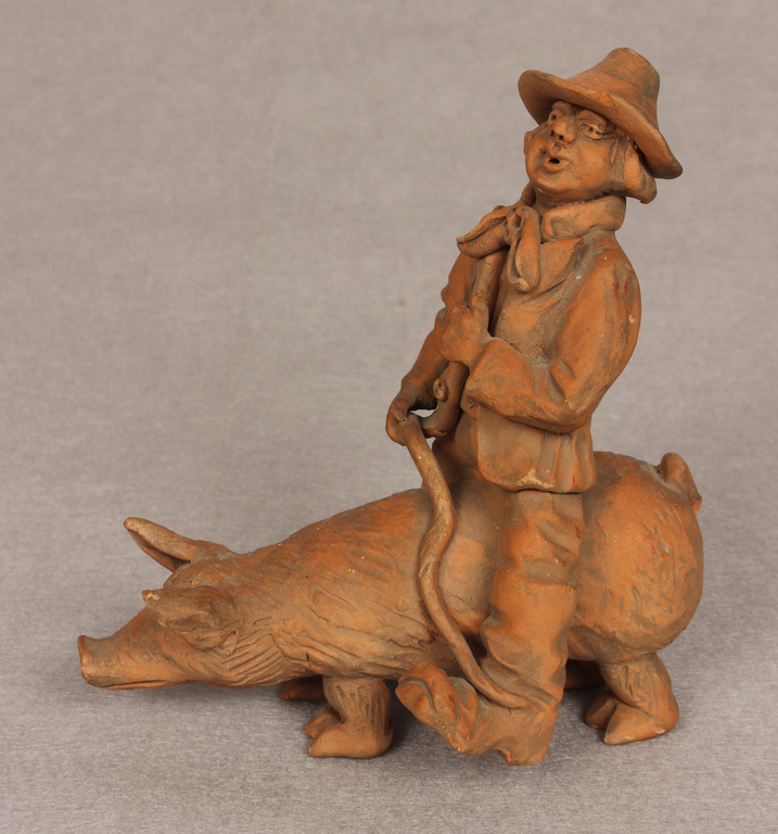 Ceramic figurine Man on a pig