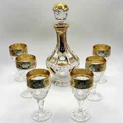 Crystal glasses and decanter. Gold edging and flowers made of applied enamel