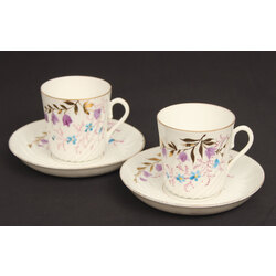 Two porcelain cups with saucers