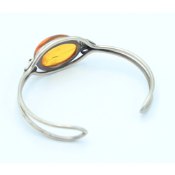 Metal bracelet with embedded amber