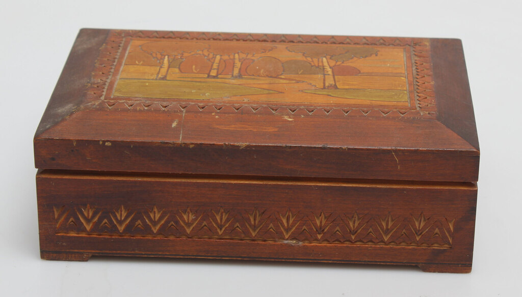 A wooden casket with a painting