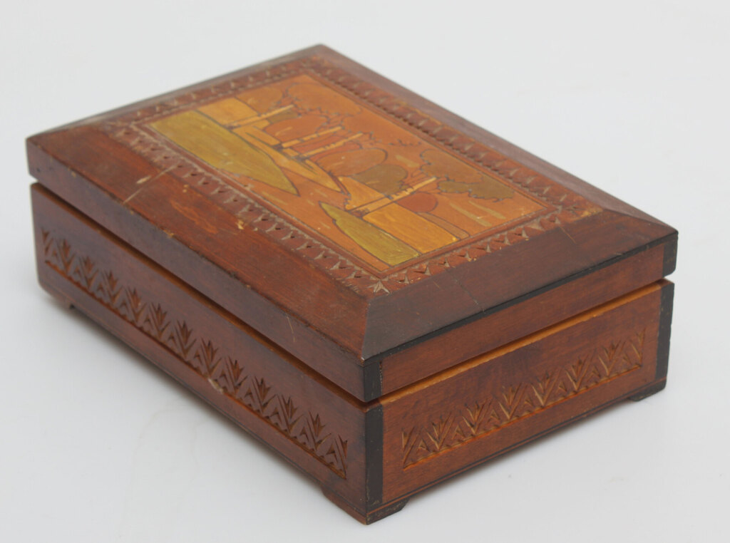 A wooden casket with a painting