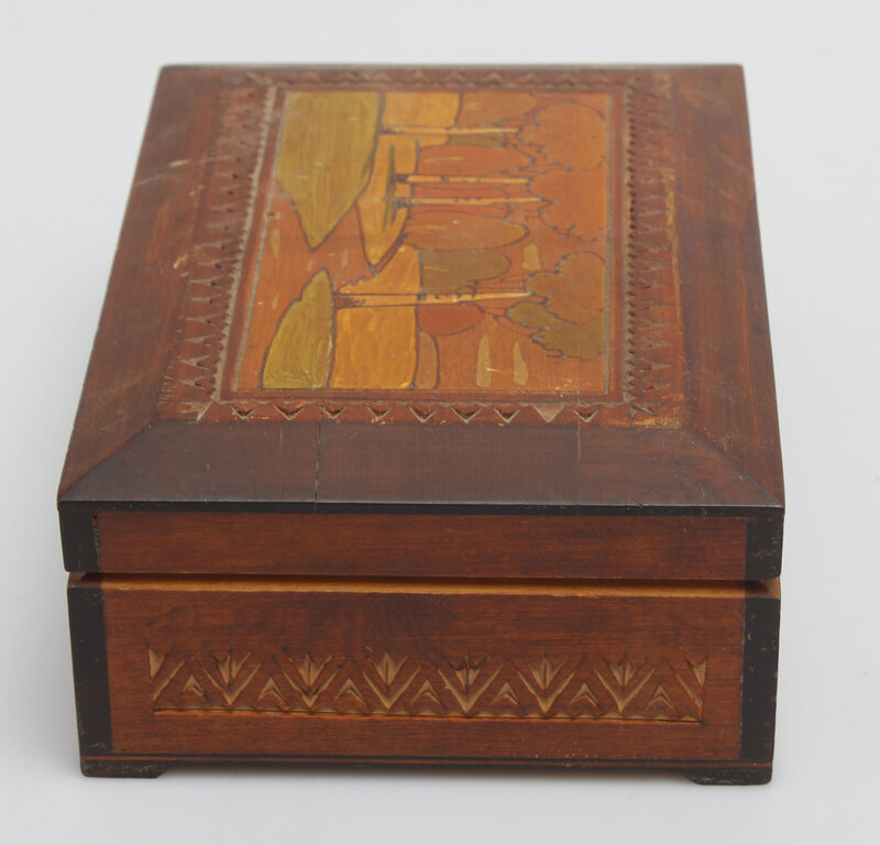 A wooden casket with a painting