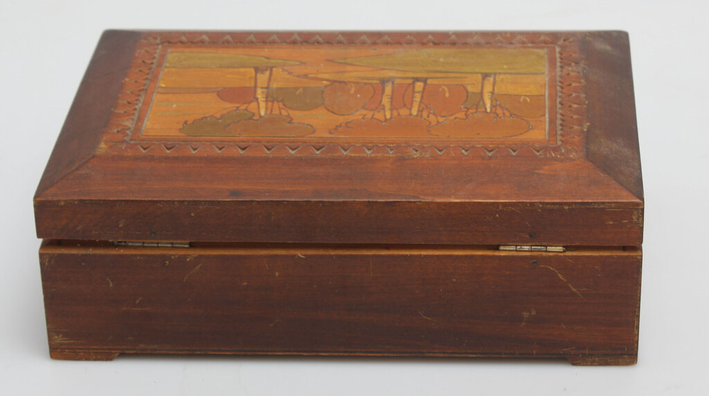 A wooden casket with a painting