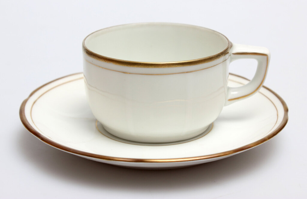 Porcelain cup with gilded rim