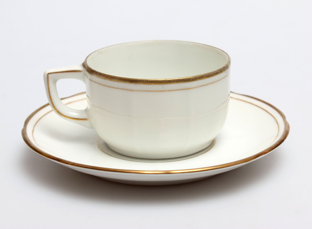 Porcelain cup with gilded rim