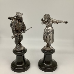 Hunter with his wife. Austria. 19th century. Paired figures on a marble pedestal. Patina.