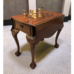 Mahogany chess table with wooden pieces. With a defect