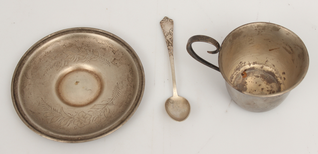 Silver cup with saucer and spoon