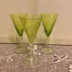 Crystal glasses made of uranium glass on a high leg. Hand-polished, diamond cuts. Bohemia.