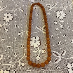 Long beads made of melted amber. Beads 2 cm and less.