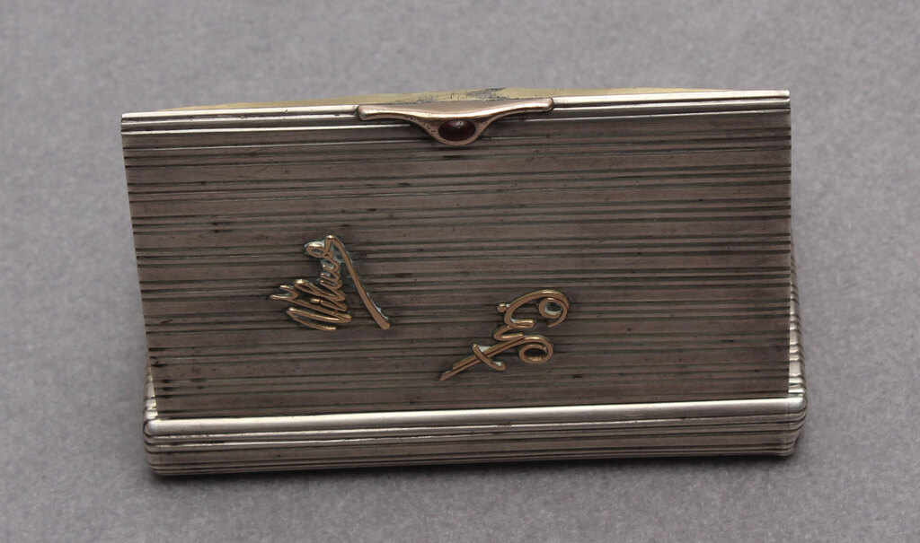 Silver cigarette holder with gold inlays