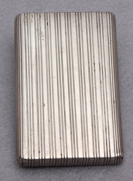 Silver cigarette holder with gold inlays