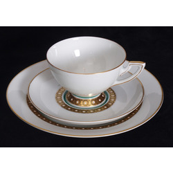 Porcelain cup with two saucers